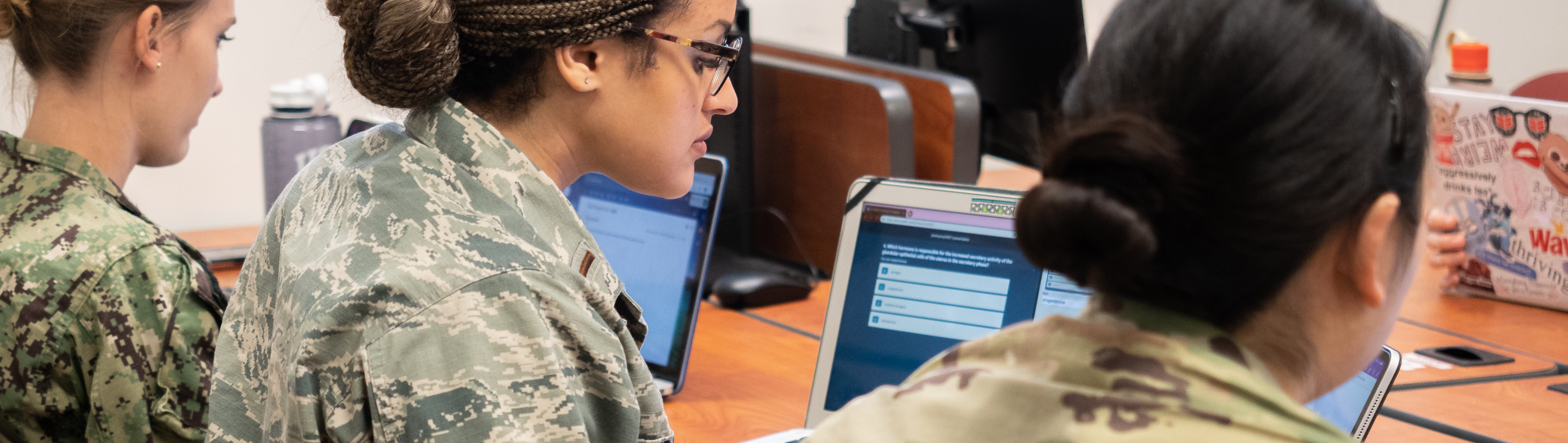 military students using laptops